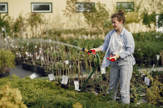 happy gardener watering plants